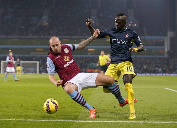 Sadio Mane of Southampton competes withal Hutton of Villa - Football - Barclays Premier League - Aston Villa vs Southampton - Villa Park Birmingham - Season 2014 2015 - 24th November 2015 - Photo Malcolm Couzens Sportimage EDITORIAL USE ONLY. No use with unauthorised audio, video, data, fixture lists, club league logos or live services. Online in-match use limited to 120 images, no video emulation. No use in betting, games or single club league player publications.