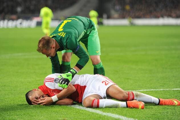 Champions League Ajax - Barcelona Amsterdam The Netherlands 5th November 2014 Champions League AFC Ajax vs FC Barcelona Barca Anwar El Ghazi injured after an elbow in the face. Barcelona keeper Marc-Andre ter Stegen check up on him. 