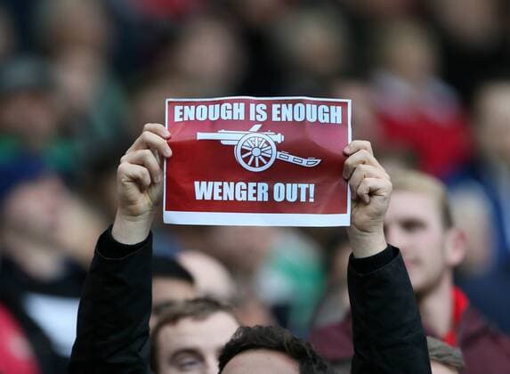 An Arsenal fan with a Arsene Wenger out sign - Barclays Premier League - FC Arsenal London - The Hawthorns - England - 29th November 2014 - EDITORIAL USE ONLY. No use with unauthorised audio, video, data, fixture lists, club league logos or live services. Online in-match use limited to 120 images, no video emulation. No use in betting, games or single club league player publications.