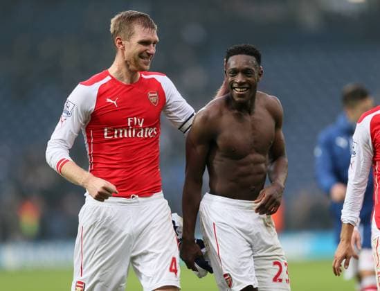 Arsenal s Danny Welbeck celebrates at the final whistle with Per Mertesacker - Barclays Premier League - West Bromwich Albion vs FC Arsenal London - The Hawthorns - England - 29th November 2014 - EDITORIAL USE ONLY. No use with unauthorised audio, video, data, fixture lists, club league logos or live services. Online in-match use limited to 120 images, no video emulation. No use in betting, games or single club league player publications.