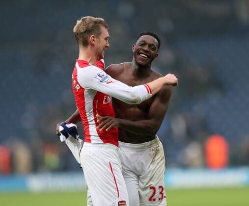 Arsenal s Danny Welbeck celebrates at the final whistle with Per Mertesacker - Barclays Premier League - West Bromwich Albion vs FC Arsenal London - The Hawthorns - England - 29th November 2014 - EDITORIAL USE ONLY. No use with unauthorised audio, video, data, fixture lists, club league logos or live services. Online in-match use limited to 120 images, no video emulation. No use in betting, games or single club league player publications.