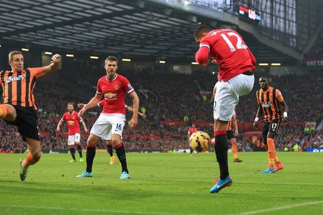 Chris Smalling of Manchester United scores the opening goal - Manchester United (ManU) vs. Hull City - Barclay s Premier League - Old Trafford - Manchester - 29 11 2014 - EDITORIAL USE ONLY. No use with unauthorised audio, video, data, fixture lists, club league logos or live services. Online in-match use limited to 120 images, no video emulation. No use in betting, games or single club league player publications.
