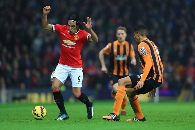Radamel Falcao of Manchester United rounds Hull s Curtis Davies - Manchester United (ManU) vs. Hull City - Barclay s Premier League - Old Trafford - Manchester - 29 11 2014 - EDITORIAL USE ONLY. No use with unauthorised audio, video, data, fixture lists, club league logos or live services. Online in-match use limited to 120 images, no video emulation. No use in betting, games or single club league player publications.