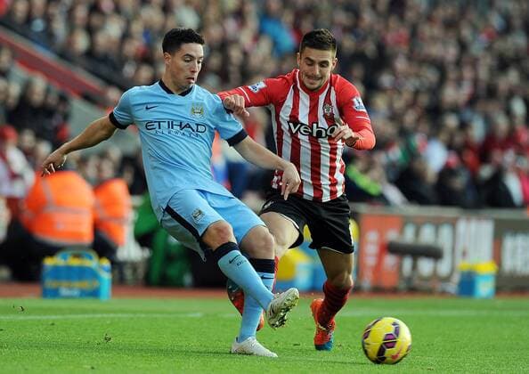 Aktuell Fußball, England, FC Southampton - Manchester City Samir Nasri of Manchester City is challenged by Dusan Tadic of Southampton - Barclays Premier League - Southampton vs Manchester City - St Mary s Stadium - Southampton - England - 30th November 2014 - Pic Robin Parker Sportimage EDITORIAL USE ONLY. No use with unauthorised audio, video, data, fixture lists, club league logos or live services. Online in-match use limited to 120 images, no video emulation. No use in betting, games or single club league player publications. TM3_2164.JPG
