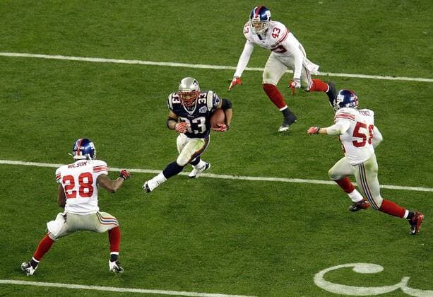 Feb. 3, 2008 - New England Patriots Kevin Faulk (33) splits the New York Giants defenders for a first down in the third qurter of Super Bowl XLII at University of Phoenix Stadium in Glendale, Arizona, on Sunday, February 3, 2008. (Mark Cornelison MCT) News Archive - Feb. 3, 2008 - ZUMAm67_