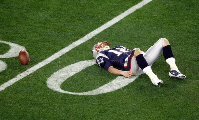 Feb. 3, 2008 - New England Patriots quarterback Tom Brady lays on the field after being sacked in the third qurter of Super Bowl XLII at University of Phoenix Stadium in Glendale, Arizona, on Sunday, February 3, 2008. (Jim Prisching MCT) News Archive - Feb. 3, 2008 - ZUMAm67_