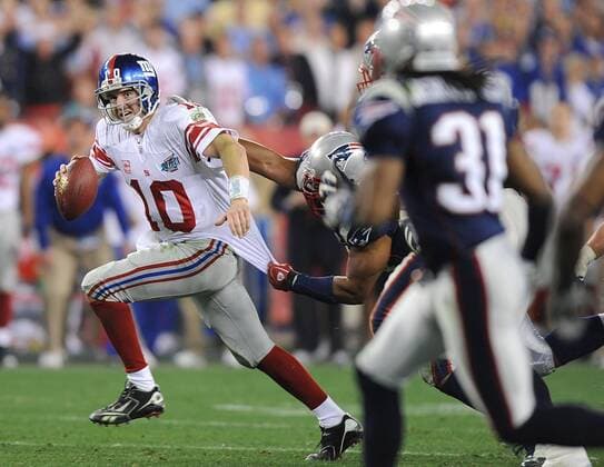 Feb. 3, 2008 - Super Bowl MVP Eli Manning of the New York Giants scrambles against the New England Patriots in a 17-14 Giants victory in Super Bowl XLII at University of Phoenix Stadium in Glendale, Arizona, on Sunday, February 3, 2008. (Karl Mondon MCT) News Archive - Feb. 3, 2008 - ZUMAm67_