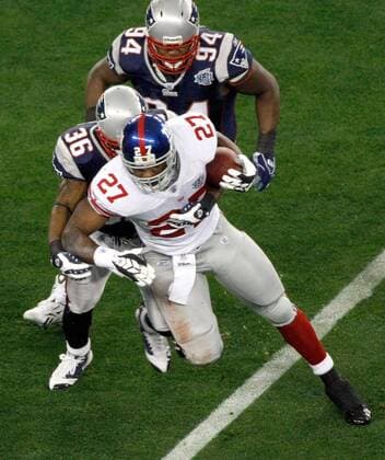 Feb. 3, 2008 - The New York Giants Brandon Jacobs (27) is stopped by the New England Patriots Jame Sanders (36) in the first quarter of Super Bowl XLII at University of Phoenix Stadium in Glendale, Arizona, on Sunday, February 3, 2008. (Jim Prisching MCT) News Archive - Feb. 3, 2008 - ZUMAm67_