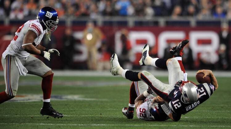 Feb. 3, 2008 - New York Giants Michael Strahan sacks New England Patriots quarterback Tom Brady in the fourth quarter of Super Bowl XLII at University of Phoenix Stadium in Glendale, Arizona, on Sunday, February 3, 2008. (Thomas A. Ferrara Newsday MCT) News Archive - Feb. 3, 2008 - ZUMAm67_