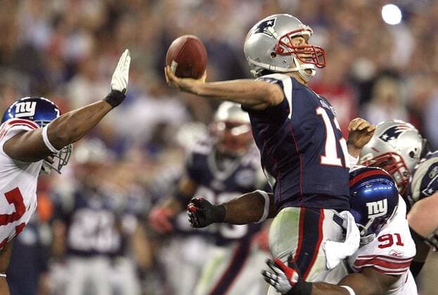 Feb. 3, 2008 - The New England Patriots Tom Brady is hit by the New York Giants Justin Tuck (91) in the first half of Super Bowl XLII at University of Phoenix Stadium in Glendale, Arizona, on Sunday, February 3, 2008. (Gary W. Green MCT) News Archive - Feb. 3, 2008 - ZUMAm67_