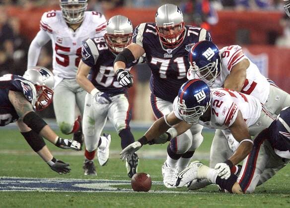 Feb. 3, 2008 - The New York Giants Osi Umenyiora (72) recovers a fumble by the New England Patriots Tom Brady in the first half of Super Bowl XLII at University of Phoenix Stadium in Glendale, Arizona, on Sunday, February 3, 2008. (Gary W. Green MCT) News Archive - Feb. 3, 2008 - ZUMAm67_