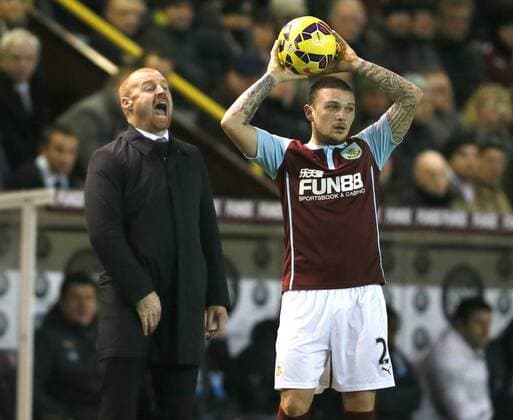 Kieran Trippier of Burnley prepares to take a throw in as manager Sean Dyche shouts instructions - Barclays Premier League - Burnley vs Newcastle Utd - Turf Moor Stadium - England - 2nd December 2014 - EDITORIAL USE ONLY. No use with unauthorised audio, video, data, fixture lists, club league logos or live services. Online in-match use limited to 120 images, no video emulation. No use in betting, games or single club league player publications.
