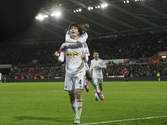 Football - 2014 2015 Premier League - Swansea City vs. Queens Park Rangers Ki Sung-Yueng of Swansea celebrates scoring their 1st goal with Nathan Dyer of Swansea at The Liberty Stadium. COLORSPORT WINSTON BYNORTH 