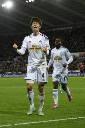 Football - 2014 2015 Premier League - Swansea City vs. Queens Park Rangers Ki Sung-Yueng of Swansea celebrates scoring their 1st goal at The Liberty Stadium. COLORSPORT WINSTON BYNORTH 