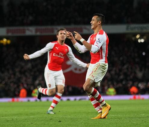 Aktuell Fußball, England, Premier League, FC Arsenal - FC Southampton Arsenal s Alexis Sanchez celebrates scoring his sides opening goal Barclays Premier League- Arsenal vs Southampton - Emirates Stadium - England - 3rd December 2014 - Picture David Klein Sportimage EDITORIAL USE ONLY. No use with unauthorised audio, video, data, fixture lists, club league logos or live services. Online in-match use limited to 120 images, no video emulation. No use in betting, games or single club league player publications.