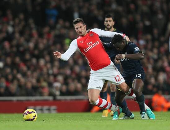 Arsenal s Olivier Giroud tussles with Southampton s Victor Wanyama Barclays Premier League- Arsenal vs Southampton - Emirates Stadium - England - 3rd December 2014 - Picture David Klein Sportimage EDITORIAL USE ONLY. No use with unauthorised audio, video, data, fixture lists, club league logos or live services. Online in-match use limited to 120 images, no video emulation. No use in betting, games or single club league player publications.