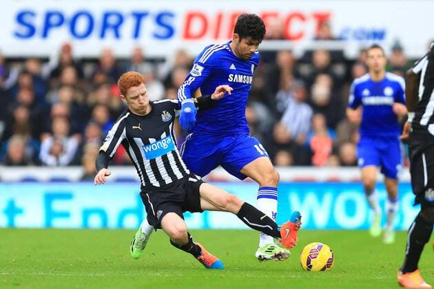 Jack Colback of Newcastle United tackles Diego Costa of Chelsea - Newcastle United vs. Chelsea - Barclay s Premier League - St James Park - Newcastle- 06 12 2014 Pic Philip Oldham Sportimage EDITORIAL USE ONLY. No use with unauthorised audio, video, data, fixture lists, club league logos or live services. Online in-match use limited to 120 images, no video emulation. No use in betting, games or single club league player publications.