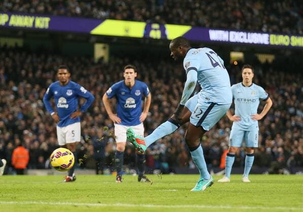 Yaya Toure of Manchester City scores the first goal from the penalty spot - Barclays Premier League - Manchester City vs Everton - Etihad Stadium - Manchester - England - 6th December 2014 - Picture Simon Bellis Sportimage EDITORIAL USE ONLY. No use with unauthorised audio, video, data, fixture lists, club league logos or live services. Online in-match use limited to 120 images, no video emulation. No use in betting, games or single club league player publications.