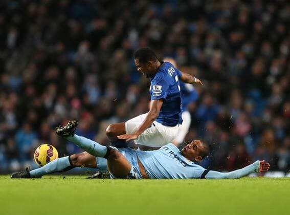 Fernando of Manchester City tackles Samuel Eto o of Everton - Barclays Premier League - Manchester City vs FC Everton - Etihad Stadium - Manchester - England - 6th December 2014 - EDITORIAL USE ONLY. No use with unauthorised audio, video, data, fixture lists, club league logos or live services. Online in-match use limited to 120 images, no video emulation. No use in betting, games or single club league player publications.