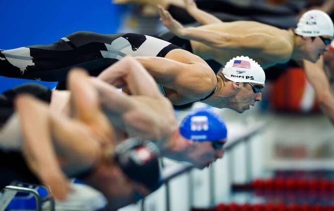 Aug. 10, 2008 - Michael Phelps of the United States leaps of the starting block in his 200-meter Freestyle qualifying heat on Sunday, August 8, 2008, in the Games of the XXIX Olympiad in Beijing, China. (David Eulitt Kansas City Star MCT) News Archive - Aug. 10, 2008 - ZUMAm67_