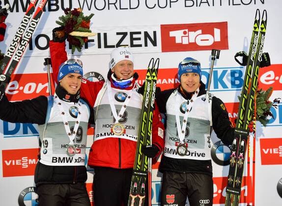 BIATHLON - IBU WC Hochfilzen HOCHFILZEN,AUSTRIA,12.DEZ.14 - BIATHLON, FLOWER CEREMONY - IBU World Cup, 10km sprint, men. Image shows Simon Schempp (GER), Johannes Thingnes Boe (NOR) and Andreas Birnbacher (GER). Keywords: award ceremony.