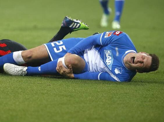 FUSSBALL - 1. BUNDESLIGA - 12.12.2014, TSG 1899 HOFFENHEIM vs. EINTRACHT FRANKFURT, Nach einem Zusammenprall mit Haris Seferovic (EINTRACHT) verletzt sich Niklas Suele Süle (1899) schwer, -