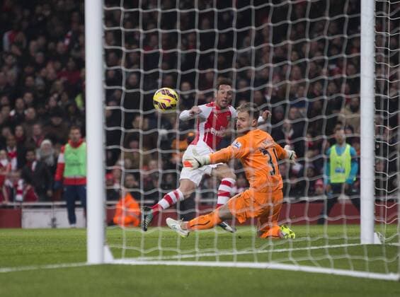 13.12.2014. London, England. Premier League. Arsenal FC versus Newcastle United. Arsenal s Santi Cazorla scores his sides second goal. xNigelxCookex  ActionPlus11582791