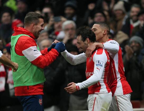 Arsenal s Santi Cazorla celebrates scoring his sides second goal Barclays Premier League- Arsenal FC vs Newcastle United - Emirates Stadium - England - 13th December 2014 - EDITORIAL USE ONLY. No use with unauthorised audio, video, data, fixture lists, club league logos or live services. Online in-match use limited to 120 images, no video emulation. No use in betting, games or single club league player publications.
