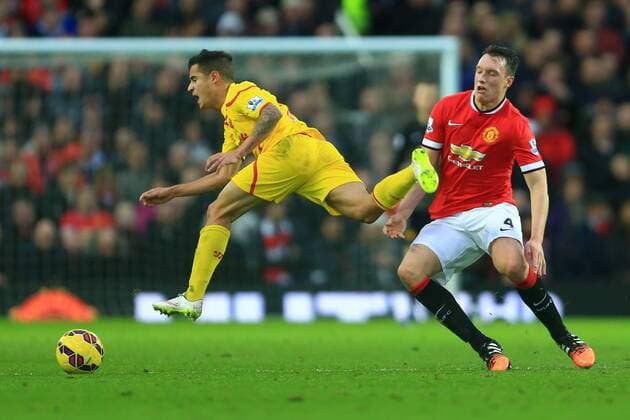 Aktuell Fußball, England, Premier League, Manchester United - FC Liverpool Phil Jones of Manchester United ManU sends Philippe Coutinho of Liverpool flying to earn a yellow card - Manchester United vs. Liverpool - Barclay s Premier League - Old Trafford - Manchester - 14 12 2014 Pic Philip Oldham Sportimage EDITORIAL USE ONLY. No use with unauthorised audio, video, data, fixture lists, club league logos or live services. Online in-match use limited to 120 images, no video emulation. No use in betting, games or single club league player publications.
