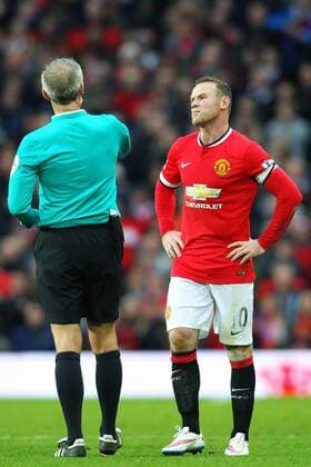 14.12.2014. Manchester, England. Premier League. Manchester United ManU versus FC Liverpool. Manchester United forward Wayne Rooney about to receive a yellow card from Referee Martin Atkinson xPaulxKeevilx  ActionPlus11583212