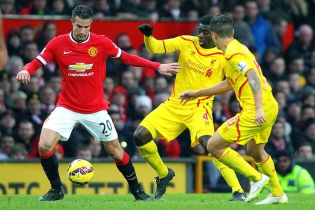 14.12.2014. Manchester, England. Premier League. Manchester United ManU versus FC Liverpool. Liverpool defender Kolo Toure battles with Manchester United forward Robin van Persie xPaulxKeevilx  ActionPlus11583221