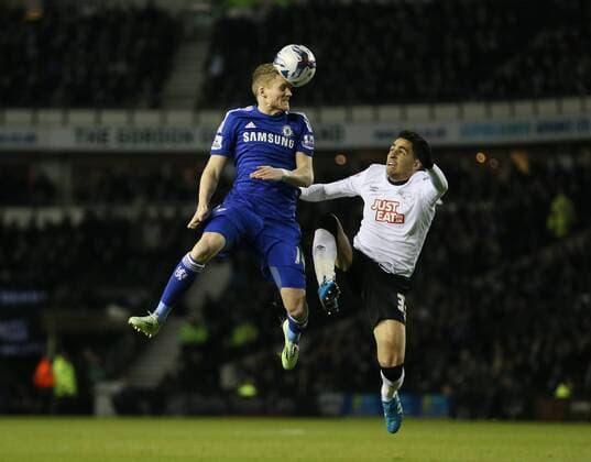 Andre Schurrle of Chelsea tussles with Omar Mascarell of Derby County - Capital One Cup Quarter Final - Derby vs Chelsea - iPro Stadium - Derby - England - 16th December 2014 - Picture Simon Bellis Sportimage EDITORIAL USE ONLY. No use with unauthorised audio, video, data, fixture lists, club league logos or live services. Online in-match use limited to 120 images, no video emulation. No use in betting, games or single club league player publications.