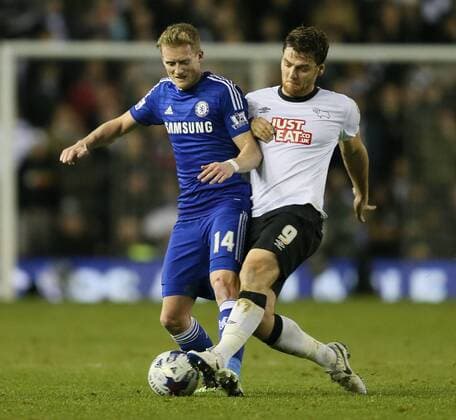 Andre Schürrle of Chelsea mussels with Chris Martin of Derby County - Capital One Cup Quarter Final - Derby vs Chelsea - iPro Stadium - Derby - England - 16th December 2014 - Picture Simon Bellis Sportimage EDITORIAL USE ONLY. No use with unauthorised audio, video, data, fixture lists, club league logos or live services. Online in-match use limited to 120 images, no video emulation. No use in betting, games or single club league player publications.