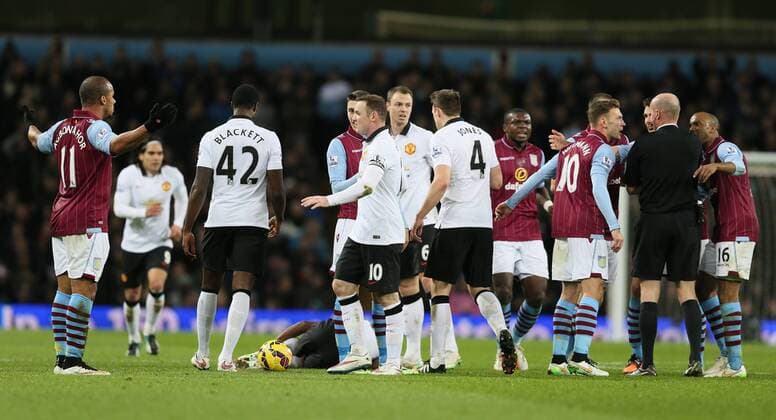 Gabriel Agbonlahor of Aston Villa asks why he has been sent off as Ashley Young of Manchester United ManU lies on the ground - Barclays Premier League - Aston Villa vs Manchester United Villa Park Stadium - Birmingham - England - 20th December 2014 - Picture SimonBellis Sportimage EDITORIAL USE ONLY. No use with unauthorised audio, video, data, fixture lists, club league logos or live services. Online in-match use limited to 120 images, no video emulation. No use in betting, games or single club league player publications.