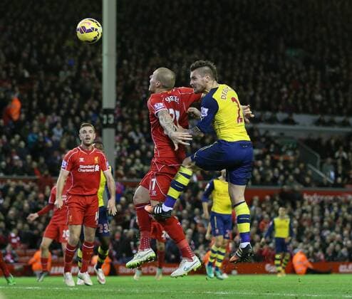 Arsenal s Mathieu Debuchy scoring his sides opening goal Barclays Premier League - Liverpool vs Arsenal - Anfield - England - 21st December 2014 - Picture David Klein Sportimage EDITORIAL USE ONLY. No use with unauthorised audio, video, data, fixture lists, club league logos or live services. Online in-match use limited to 120 images, no video emulation. No use in betting, games or single club league player publications.