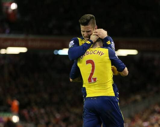 Arsenal s Mathieu Debuchy celebrates scoring his sides opening goal with Olivier Giroud Barclays Premier League - Liverpool vs Arsenal - Anfield - England - 21st December 2014 - Picture David Klein Sportimage EDITORIAL USE ONLY. No use with unauthorised audio, video, data, fixture lists, club league logos or live services. Online in-match use limited to 120 images, no video emulation. No use in betting, games or single club league player publications.