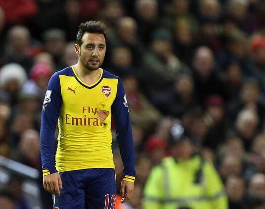 Aktuell Fußball, England, Premier League, Santi Carzola vom FC Arsenal mit kurioser Verletzung Arsenal s Santi Cazorla looks at his cut and ripped shirt after a high tackle Barclays Premier League - Liverpool FC vs Arsenal FC - Anfield - England - 21st December 2014 - EDITORIAL USE ONLY. No use with unauthorised audio, video, data, fixture lists, club league logos or live services. Online in-match use limited to 120 images, no video emulation. No use in betting, games or single club league player publications.