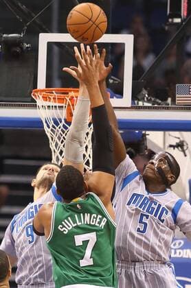 Dec. 16, 2014 - Orlando, FL, USA - The Orlando Magic s Nikola Vucevic (9) and Victor Oladipo (5) block the shot of the Boston Celtics Jared Sullinger (7) at the Amway Center in Orlando, Fla., on Tuesday, Dec. 23, 2014. Boston at Orlando - ZUMAm67_