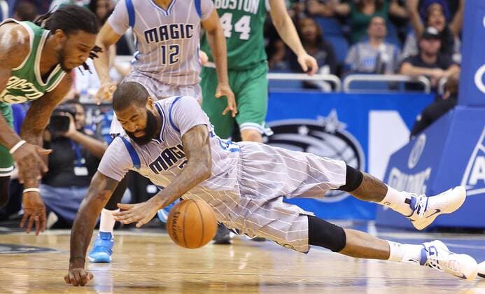 Dec. 16, 2014 - Orlando, FL, USA - The Orlando Magic s Kyle O Quinn (2) dives for a loose ball against the Boston Celtics at the Amway Center in Orlando, Fla., on Tuesday, Dec. 23, 2014. The Magic won, 100-95. Boston at Orlando - ZUMAm67_