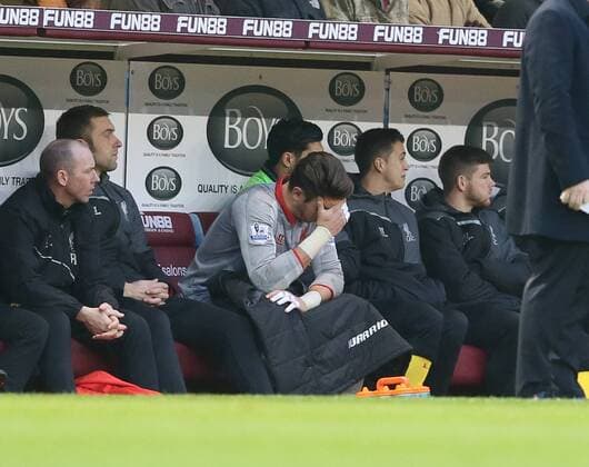 Brad Jones of Liverpool sits on the bench distraught after leaving the game injured - Barclays Premier League - Burnley FC vs FC Liverpool - Turf Moor Stadium - Burnley - England - 26th December 2014 - Picture Simon Bellis Sportimage EDITORIAL USE ONLY. No use with unauthorised audio, video, data, fixture lists, club league logos or live services. Online in-match use limited to 120 images, no video emulation. No use in betting, games or single club league player publications.