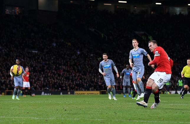 Manchester United ManU s Wayne Rooney scoring his sides second goal Barclays Premier League - Manchester United vs Newcastle United - Old Trafford - England - 26th December 2014 - Picture David Klein Sportimage EDITORIAL USE ONLY. No use with unauthorised audio, video, data, fixture lists, club league logos or live services. Online in-match use limited to 120 images, no video emulation. No use in betting, games or single club league player publications.