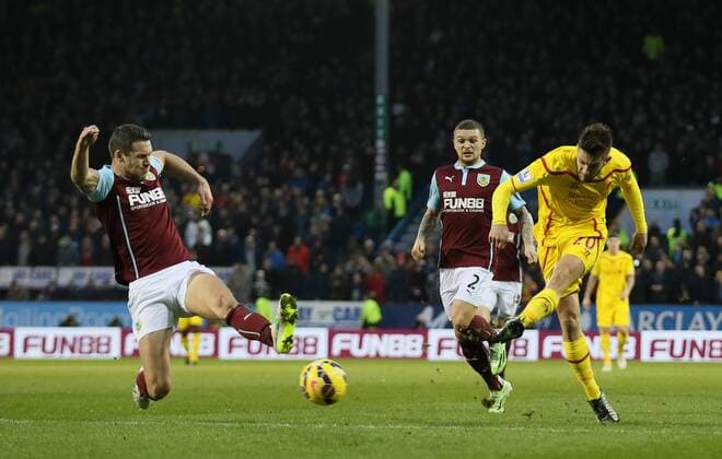 Adam Lallana of Liverpool fires in a shot on goal - Barclays Premier League - Burnley FC vs FC Liverpool - Turf Moor Stadium - Burnley - England - 26th December 2014 - Picture Simon Bellis Sportimage EDITORIAL USE ONLY. No use with unauthorised audio, video, data, fixture lists, club league logos or live services. Online in-match use limited to 120 images, no video emulation. No use in betting, games or single club league player publications.