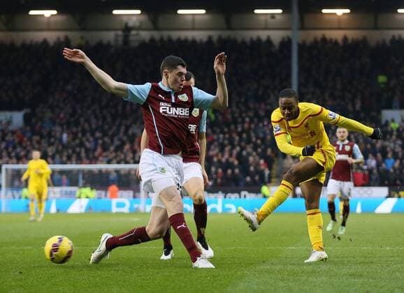 Raheem Sterling of Liverpool fires in a shot on goal - Barclays Premier League - Burnley FC vs FC Liverpool - Turf Moor Stadium - Burnley - England - 26th December 2014 - Picture Simon Bellis Sportimage EDITORIAL USE ONLY. No use with unauthorised audio, video, data, fixture lists, club league logos or live services. Online in-match use limited to 120 images, no video emulation. No use in betting, games or single club league player publications.
