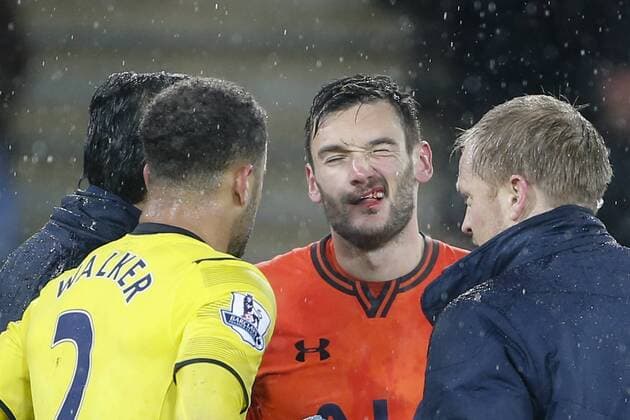26.12.2014. Leicester, England. Premier League. Leicester City versus Tottenham Hotspur. Hugo Lloris of Tottenham Hotspur receives treatment after losing atooth in a stoppage time clash with Jamie Vardy of Leicester City. Final score: Leicester City 1-2 Tottenham Hotspur. xJohnxKirkpatrickx  ActionPlus11585007
