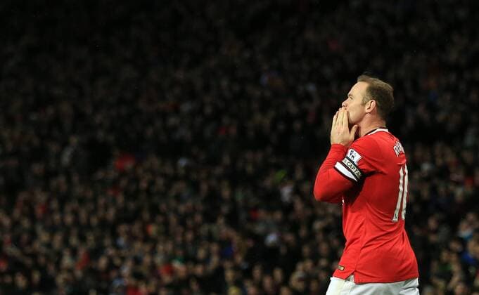 Manchester United ManU s Wayne Rooney celebrates scoring his sides second goal Barclays Premier League - Manchester United vs Newcastle United - Old Trafford - England - 26th December 2014 - Picture David Klein Sportimage EDITORIAL USE ONLY. No use with unauthorised audio, video, data, fixture lists, club league logos or live services. Online in-match use limited to 120 images, no video emulation. No use in betting, games or single club league player publications.