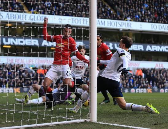 Tottenham s Vlad Chiriches clears on the line from Manchester United ManU s Robin Van Persie Barclays Premier League - Tottenham Hotspur vs Manchester United - White Hart Lane - England - 28th December 2014 - Picture David Klein Sportimage EDITORIAL USE ONLY. No use with unauthorised audio, video, data, fixture lists, club league logos or live services. Online in-match use limited to 120 images, no video emulation. No use in betting, games or single club league player publications.