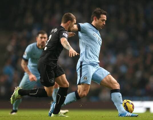 Frank Lampard of Manchester City held up by Kieran Trippier of Burnley - Barclays Premier League - Manchester City vs Burnley FC - Etihad Stadium - Manchester - England - 28th December 2014 - Picture Simon Bellis Sportimage EDITORIAL USE ONLY. No use with unauthorised audio, video, data, fixture lists, club league logos or live services. Online in-match use limited to 120 images, no video emulation. No use in betting, games or single club league player publications.