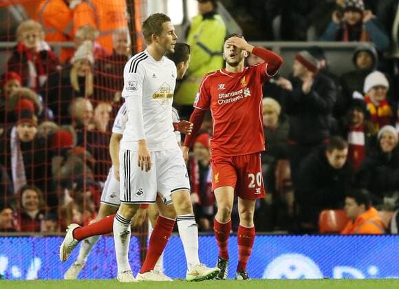 Adam Lallana of FC Liverpool reacts after missing a chance to score - Barclays Premier League - FC Liverpool vs Swansea City - Anfield Stadium - Liverpool - England - 29th December 2014 - EDITORIAL USE ONLY. No use with unauthorised audio, video, data, fixture lists, club league logos or live services. Online in-match use limited to 120 images, no video emulation. No use in betting, games or single club league player publications.