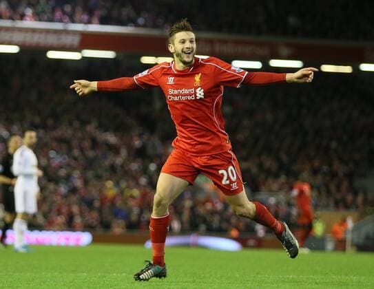Adam Lallana of FC Liverpool celebrates after chasing down a back pass to score from the attempted clearance by Lucas Fabianski of Swansea City - Barclays Premier League - FC Liverpool vs Swansea City - Anfield Stadium - Liverpool - England - 29th December 2014 - EDITORIAL USE ONLY. No use with unauthorised audio, video, data, fixture lists, club league logos or live services. Online in-match use limited to 120 images, no video emulation. No use in betting, games or single club league player publications.