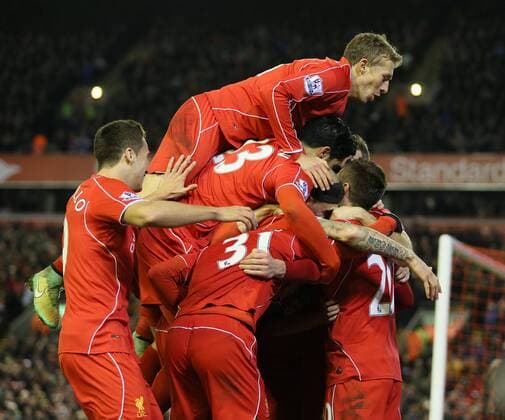Adam Lallana of Liverpool is mobbed after scoring the second goal - Barclays Premier League - Liverpool vs Swansea City - Anfield Stadium - Liverpool - England - 29th December 2014 - Picture Simon Bellis Sportimage EDITORIAL USE ONLY. No use with unauthorised audio, video, data, fixture lists, club league logos or live services. Online in-match use limited to 120 images, no video emulation. No use in betting, games or single club league player publications.